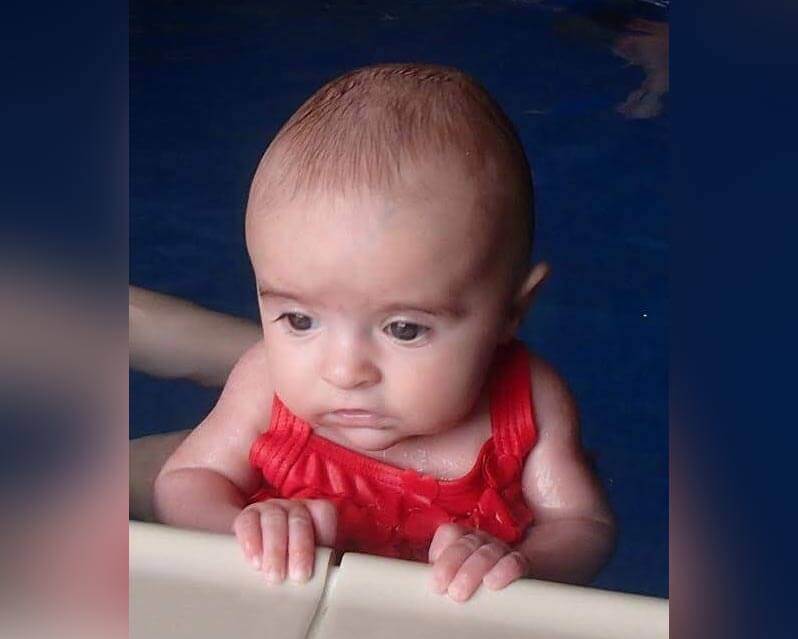 Baby enjoying a swimming lesson at Dalston Leisure Pool in Carlisle